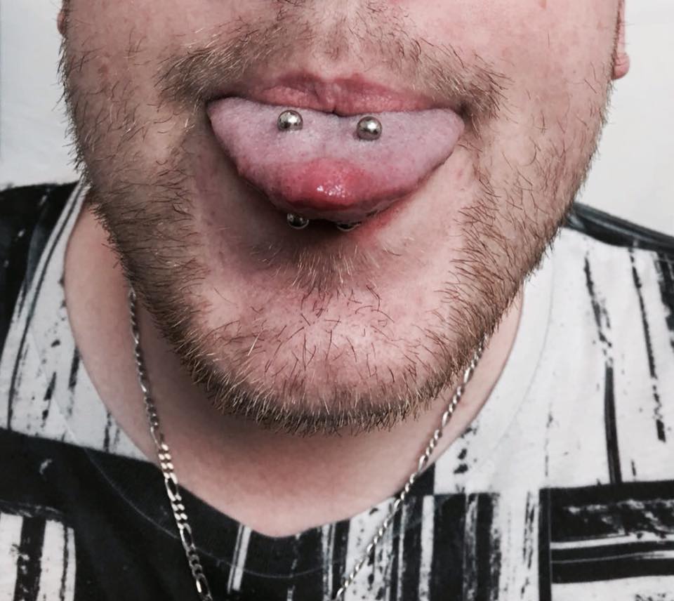 Male tongue piercing